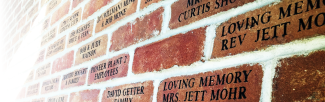 Close-up view of donor bricks on the outside of the library building
